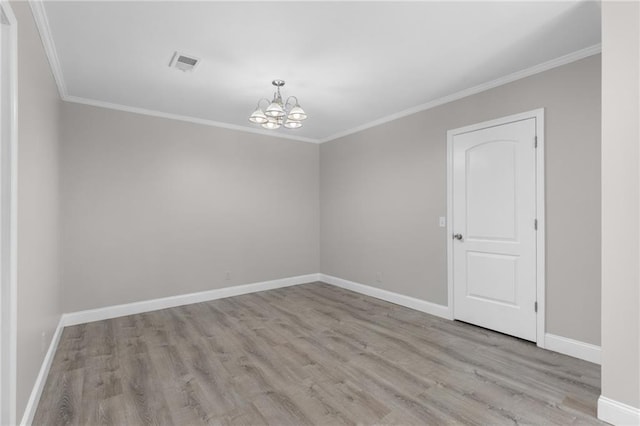 765 Houston Mill Rd NE Unit 7, Atlanta, GA 30329 - spare room featuring a chandelier, wood finished floors, ornamental molding, and baseboards