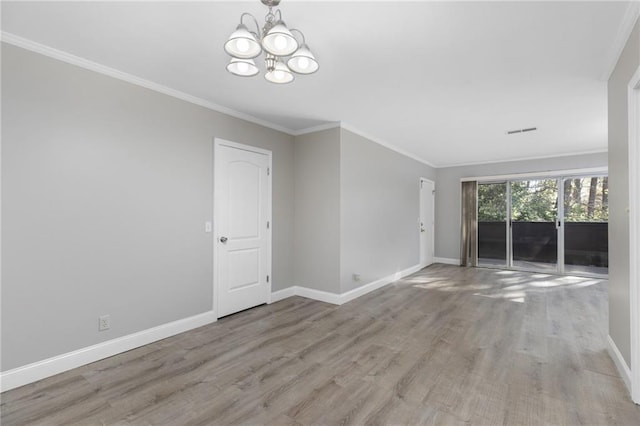 765 Houston Mill Rd NE Unit 7, Atlanta, GA 30329 - empty room with a chandelier, wood finished floors, baseboards, and ornamental molding