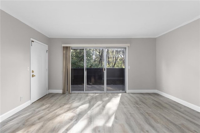 765 Houston Mill Rd NE Unit 7, Atlanta, GA 30329 - spare room with wood finished floors, baseboards, and ornamental molding