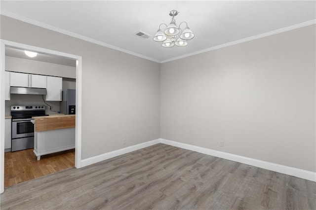 765 Houston Mill Rd NE Unit 7, Atlanta, GA 30329 - unfurnished dining area featuring light wood-style floors, a chandelier, baseboards, and crown molding