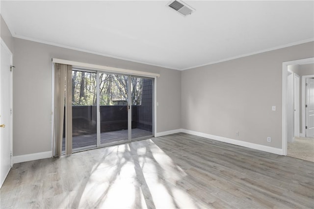 765 Houston Mill Rd NE Unit 7, Atlanta, GA 30329 - spare room featuring baseboards, wood finished floors, and crown molding