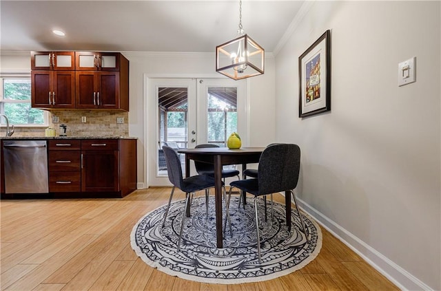 2985 Westbury Dr, Decatur, GA 30033 - dining area with a chandelier, ornamental molding, french doors, light wood-type flooring, and healthy amount of natural light