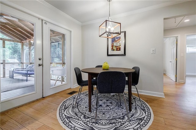 2985 Westbury Dr, Decatur, GA 30033 - dining room with light wood finished floors, ornamental molding, baseboards, and a chandelier