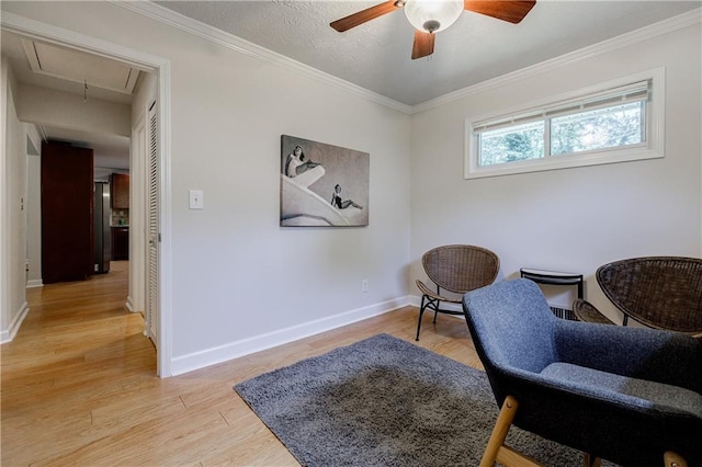 2985 Westbury Dr, Decatur, GA 30033 - living area with attic access, a ceiling fan, light wood finished floors, baseboards, and ornamental molding