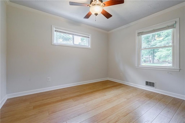 2985 Westbury Dr, Decatur, GA 30033 - spare room featuring healthy amount of natural light, light wood-style flooring, crown molding, baseboards, and ceiling fan