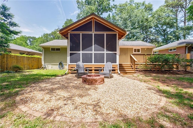 2985 Westbury Dr, Decatur, GA 30033 - rear view of property with a fire pit, a sunroom, fence, and a deck