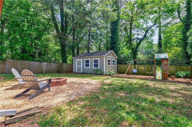 2985 Westbury Dr, Decatur, GA 30033 - view of yard featuring a fire pit, a playground, and an outbuilding