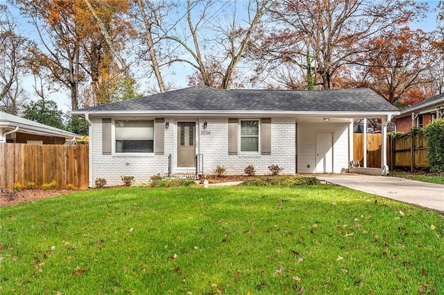 ranch-style house with a front lawn and a carport