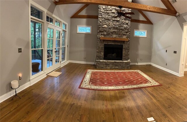 unfurnished living room featuring french doors, high vaulted ceiling, beamed ceiling, and dark hardwood / wood-style flooring