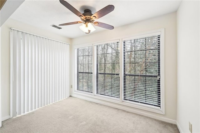 carpeted empty room with ceiling fan