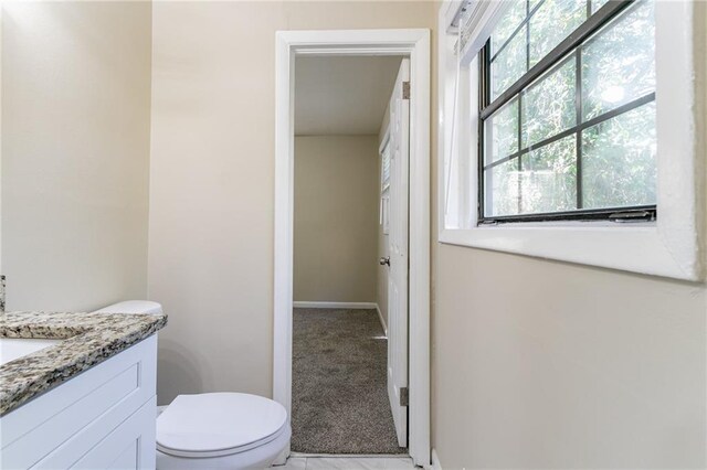 bathroom with vanity and toilet