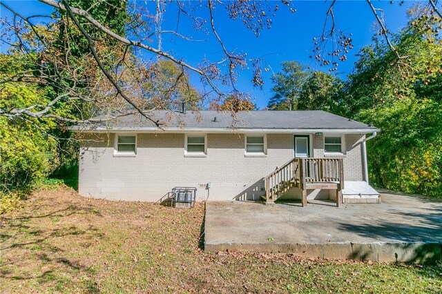 rear view of property featuring a patio area