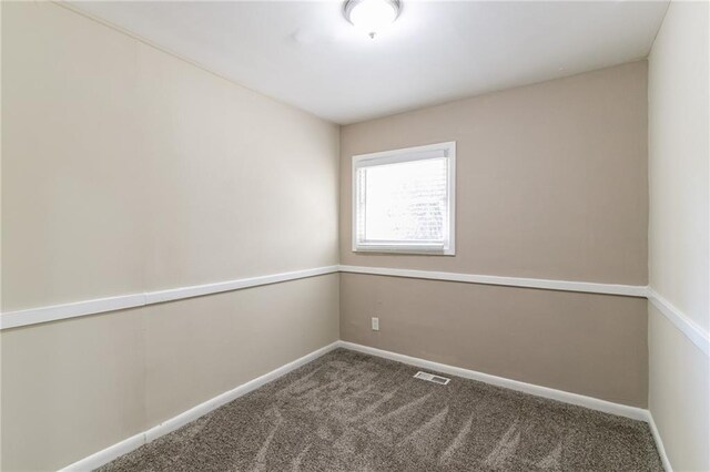 unfurnished room featuring carpet floors