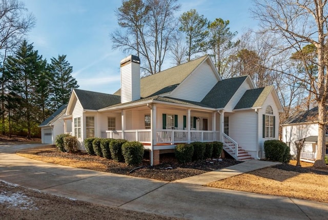 view of front of home with a garage and covered porch