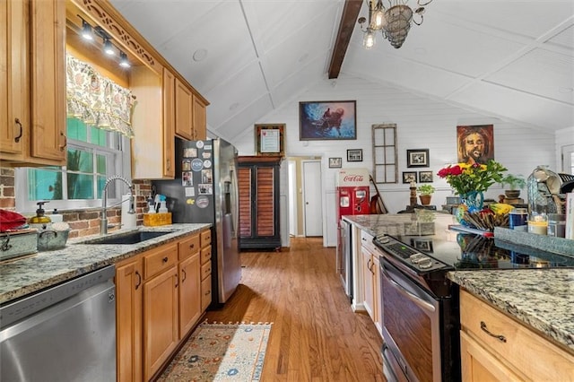 8669 Davis St, Braselton, GA 30517 - kitchen with stainless steel appliances, a sink, light wood-style flooring, light stone countertops, and tasteful backsplash
