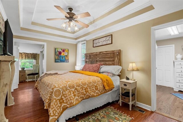 8669 Davis St, Braselton, GA 30517 - bedroom featuring a raised ceiling, wood finished floors, ornamental molding, baseboards, and a ceiling fan