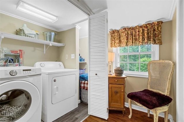 8669 Davis St, Braselton, GA 30517 - laundry area featuring washer and dryer, dark wood finished floors, and ornamental molding