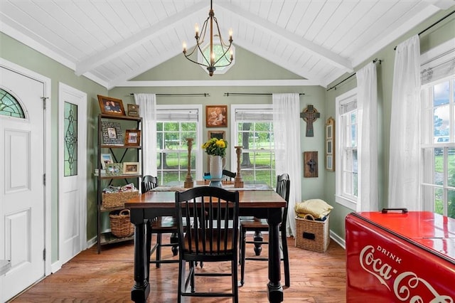 8669 Davis St, Braselton, GA 30517 - dining space featuring wood finished floors, a chandelier, and baseboards