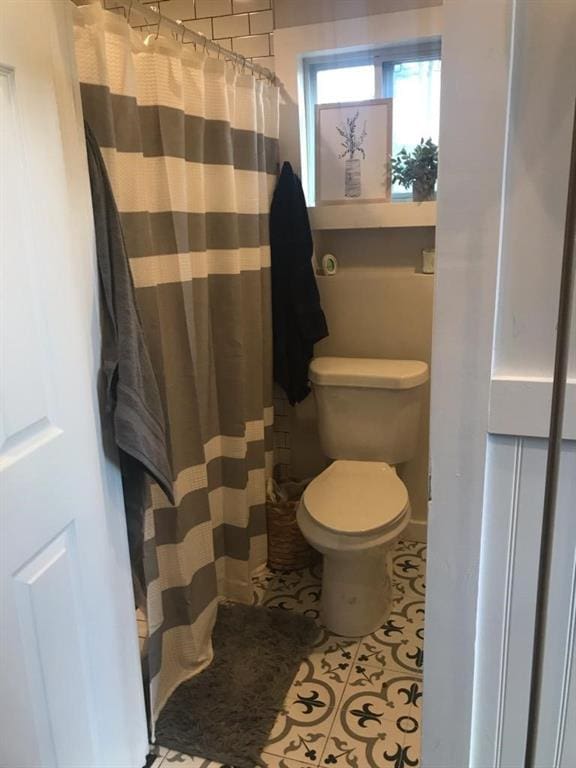 8669 Davis St, Braselton, GA 30517 - bathroom with toilet and a shower with curtain