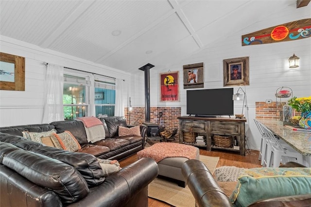 8669 Davis St, Braselton, GA 30517 - living area featuring light wood-style flooring, a wood stove, and wooden walls