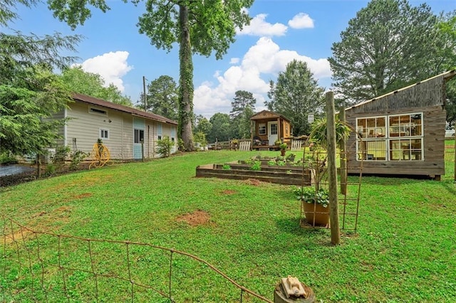 8669 Davis St, Braselton, GA 30517 - view of grassy yard featuring a vegetable garden