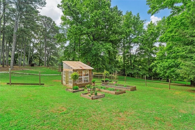 8669 Davis St, Braselton, GA 30517 - view of yard with a garden, an outdoor structure, and view of wooded area