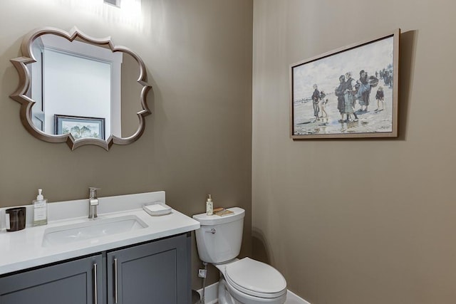 bathroom with toilet and vanity