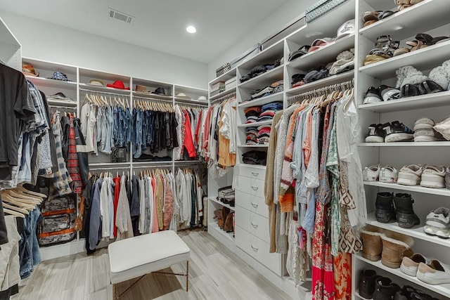 spacious closet featuring light hardwood / wood-style flooring