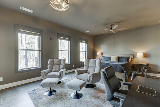 bedroom featuring ceiling fan and multiple windows