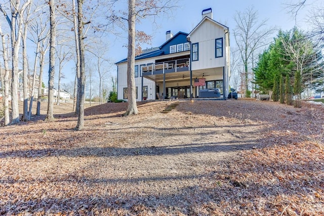 rear view of house with ceiling fan