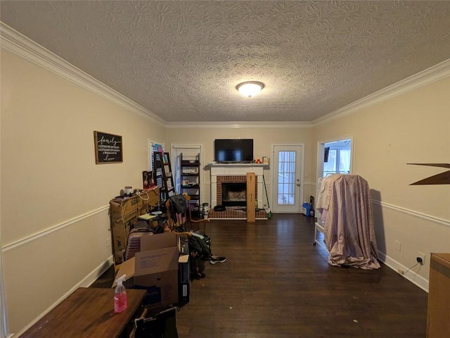 405 Baneberry Bnd, Peachtree City, GA 30269 - interior space featuring ornamental molding, a brick fireplace, a textured ceiling, and dark hardwood / wood-style flooring