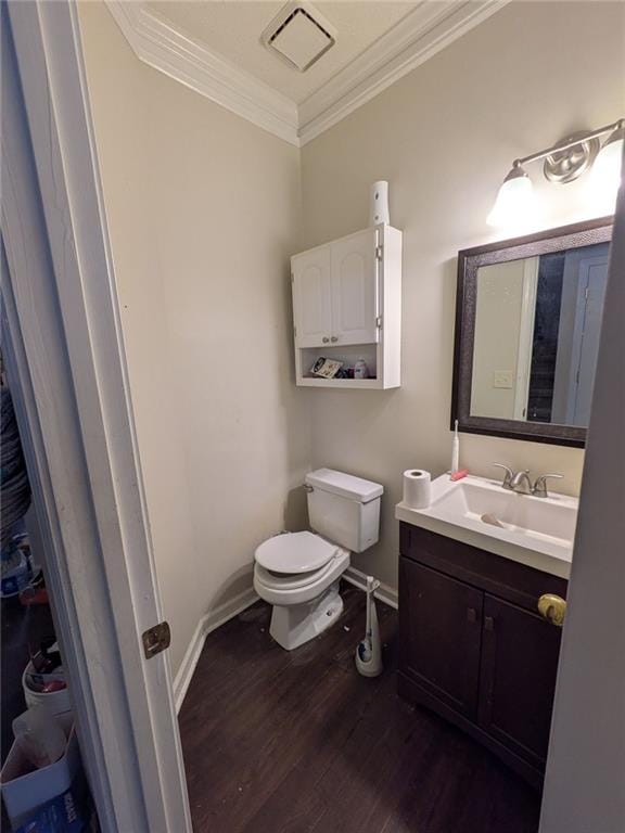 405 Baneberry Bnd, Peachtree City, GA 30269 - bathroom featuring crown molding, hardwood / wood-style floors, vanity, and toilet