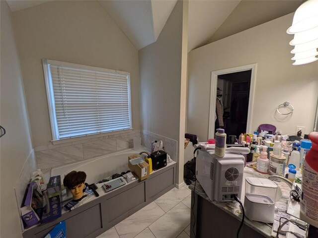 405 Baneberry Bnd, Peachtree City, GA 30269 - bathroom featuring lofted ceiling and a washtub