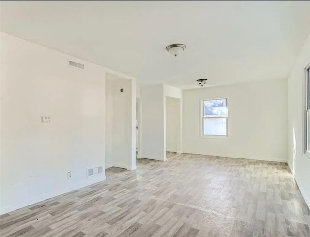 empty room with visible vents and light wood-type flooring