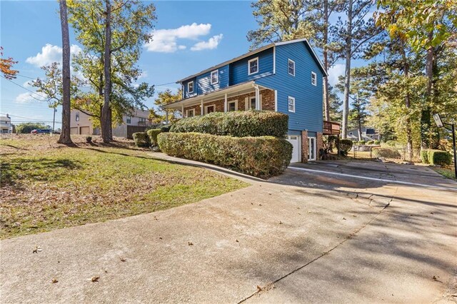 view of front of property with a garage and a front lawn