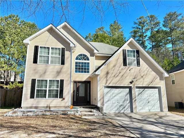 view of front of house featuring fence, driveway, an attached garage, and central air condition unit