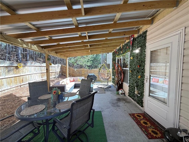 view of patio with an outdoor hangout area, outdoor dining space, and a fenced backyard