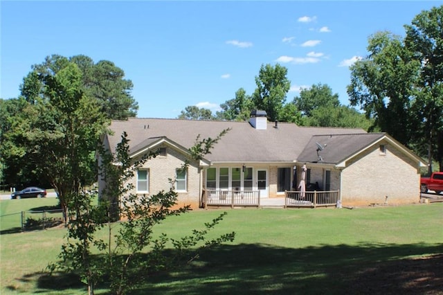 back of house featuring a yard