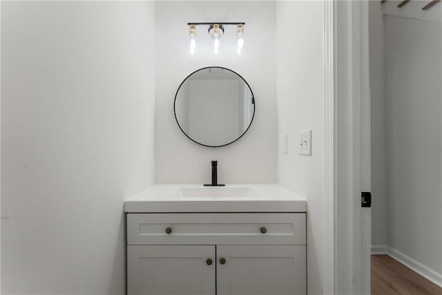 3285 Country Walk Dr, Powder Springs, GA 30127 - bathroom with vanity, wood finished floors, and baseboards