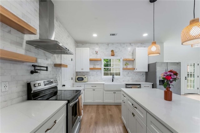 3285 Country Walk Dr, Powder Springs, GA 30127 - kitchen with open shelves, stainless steel appliances, wall chimney exhaust hood, a sink, and backsplash