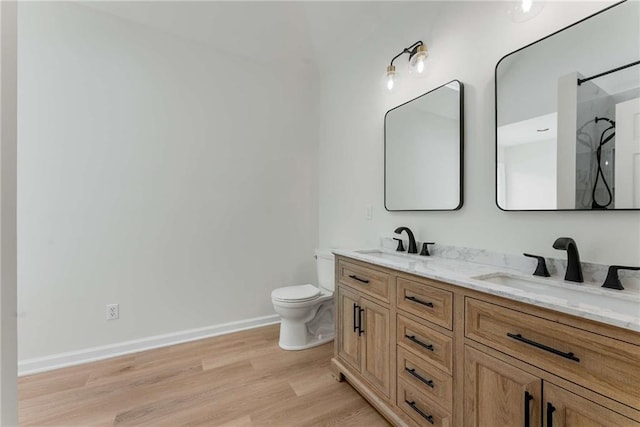 3285 Country Walk Dr, Powder Springs, GA 30127 - full bathroom with wood finished floors, toilet, double vanity, baseboards, and a shower