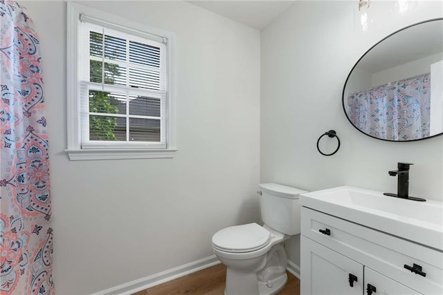 3285 Country Walk Dr, Powder Springs, GA 30127 - full bathroom featuring baseboards, toilet, vanity, wood finished floors, and a shower with shower curtain