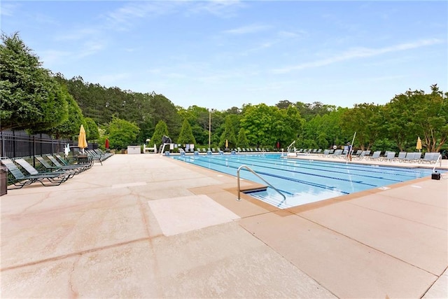 3285 Country Walk Dr, Powder Springs, GA 30127 - community pool featuring a patio and fence