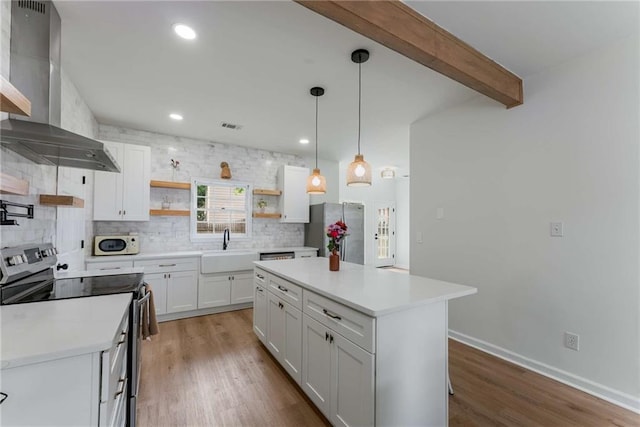 3285 Country Walk Dr, Powder Springs, GA 30127 - kitchen featuring appliances with stainless steel finishes, wall chimney exhaust hood, a sink, open shelves, and decorative backsplash