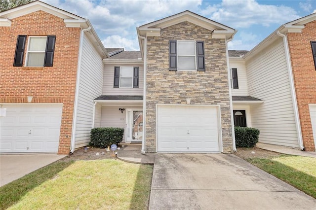 traditional home with an attached garage, stone siding, and concrete driveway