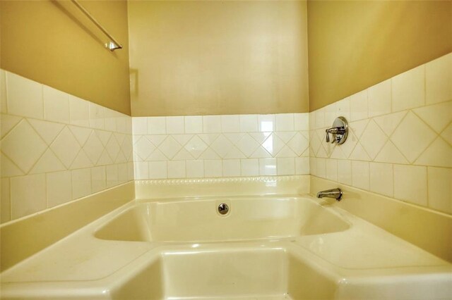 full bath featuring a bath