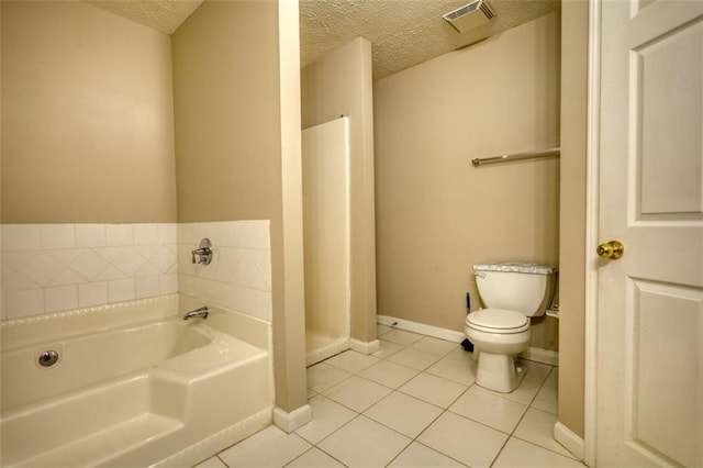 full bathroom featuring visible vents, toilet, tile patterned flooring, a textured ceiling, and a bath