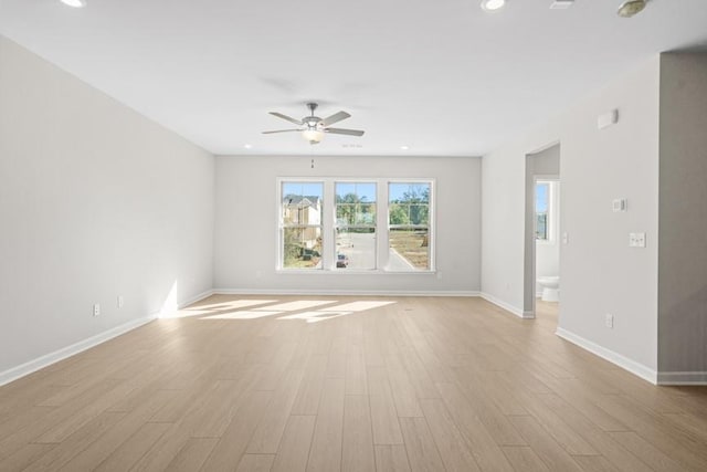 spare room featuring ceiling fan and light hardwood / wood-style floors