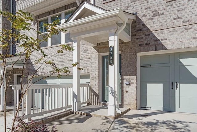 view of exterior entry featuring a garage