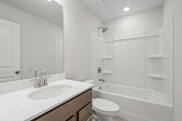 full bathroom featuring toilet, vanity, and bathtub / shower combination